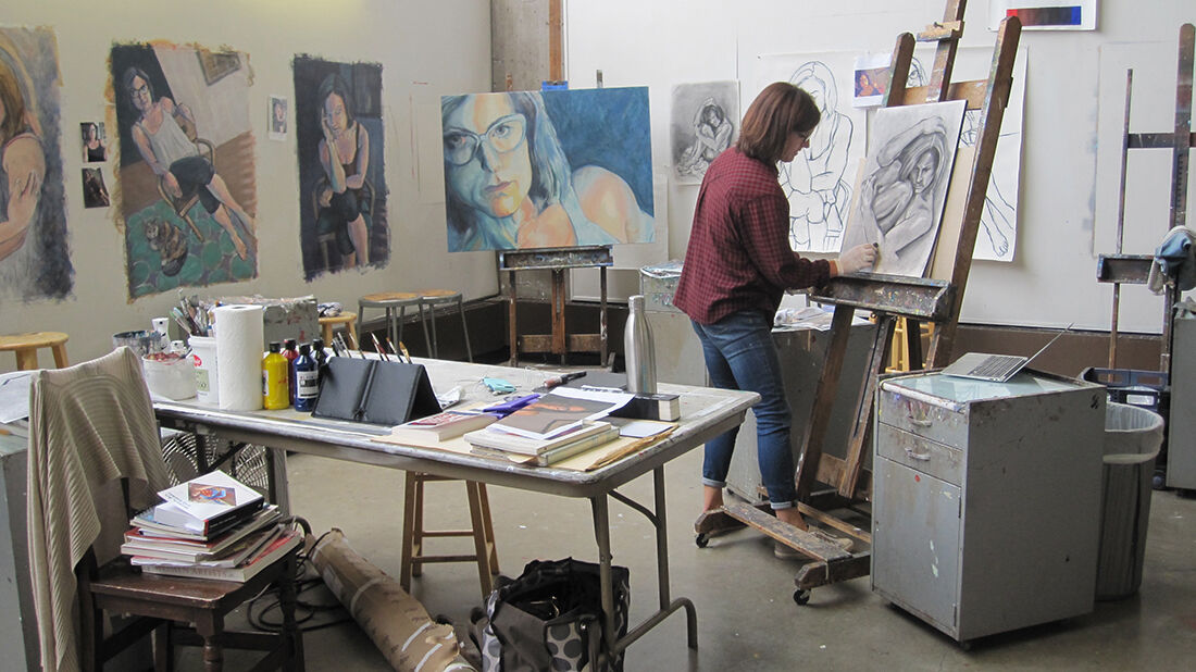 Women painting in art studio