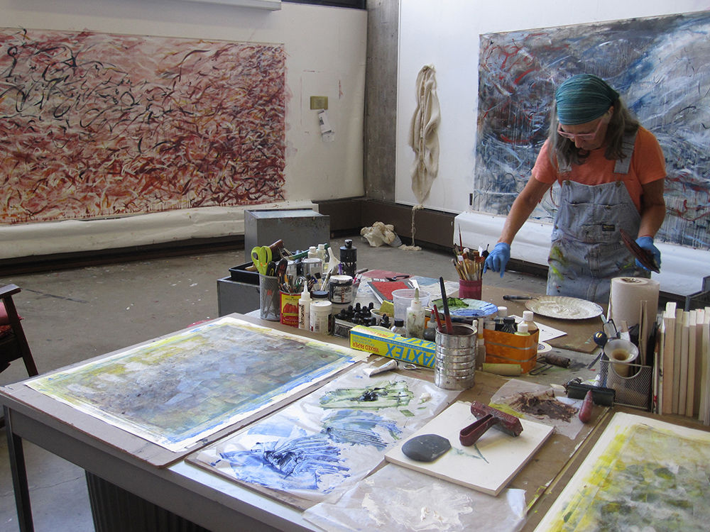 Artist working on art in studio