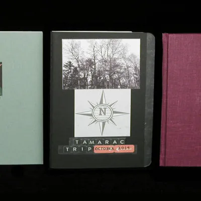 "Trip Journals:" New York, 2004; Tamarac Trip, 2019; Nova Scotia, 2000; notebooks with photographs and collage, various sizes.