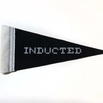 Black banner with the words Inducted on it.