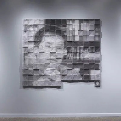 Tiled portraits of adoptees Andy Tulenchikandy, Matthew Johnson, and Nathan Twedt.