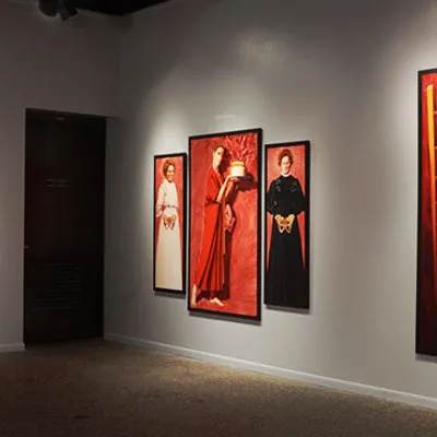 Inside gallery showing 9 paintings