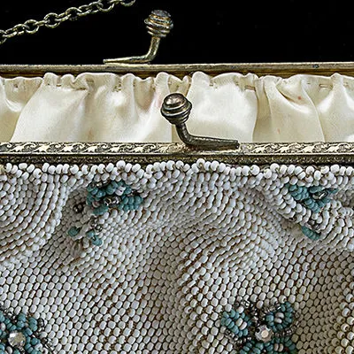 Vintage white beaded purse with turquoise beaded flowers and metal clasp
