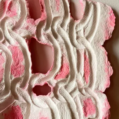 Handmade paper with pressed coils and florescent pink color