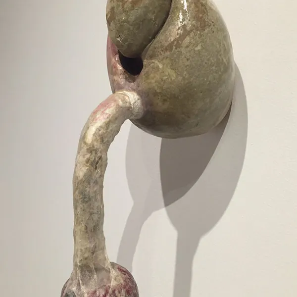Martha Russo Plug, 2000, clay, gaze, pig intestine, pomegranate, purple grapes, 20 x 6 x 8"