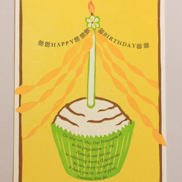 Catherine Alice Michaelis/May Day Press, "Pandemic Post #6: Happy Birthday; Edition: 70," reduction linoleum print, hand-colored, letterpress printed handset type, 6.25” x 4.5” A cupcake with a candle in it to celebrate the birthday of May Day Press and of the artist, who is an owner of the press.