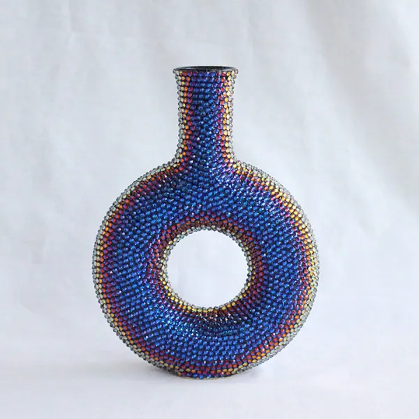 Frances Johnson Donut, 2020 | ceramic, Swarovski Crystals, 6.25 (l) x 1.75 (w) x 8.5 (h)", NFS