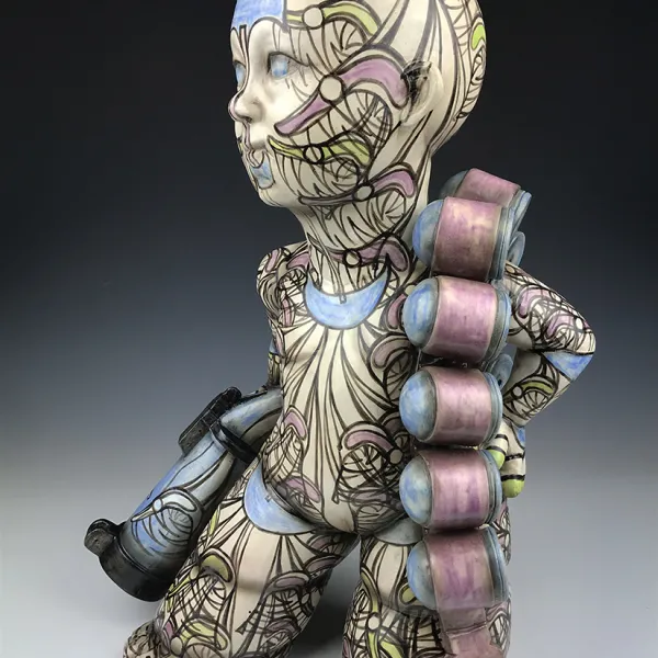 Guillermo Guardia, Mochica GG, 2019 ceramics, underglazes, clear glaze, 24 x 10” A ceramic human-like figure, tattooed from head to foot, with small horns on its head. Its legs and feet are wide. It's carrying a weapon(?) and has ammo(?) slung over its shoulder.
