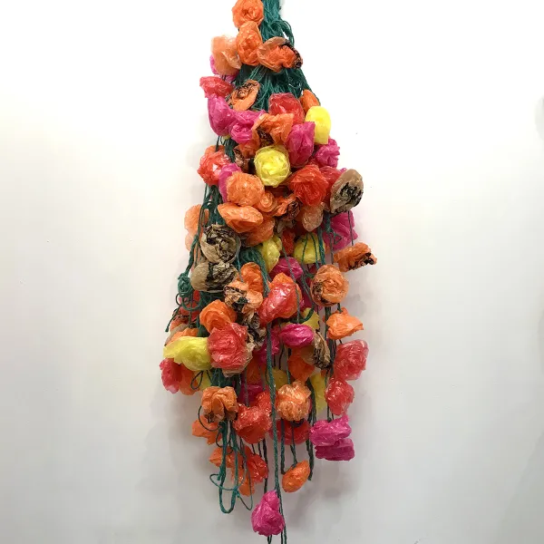 Nora Rickey "Trash Roses Last Forever," repurposed newspaper bags, biodegradable hemp twine, 6' x 2'