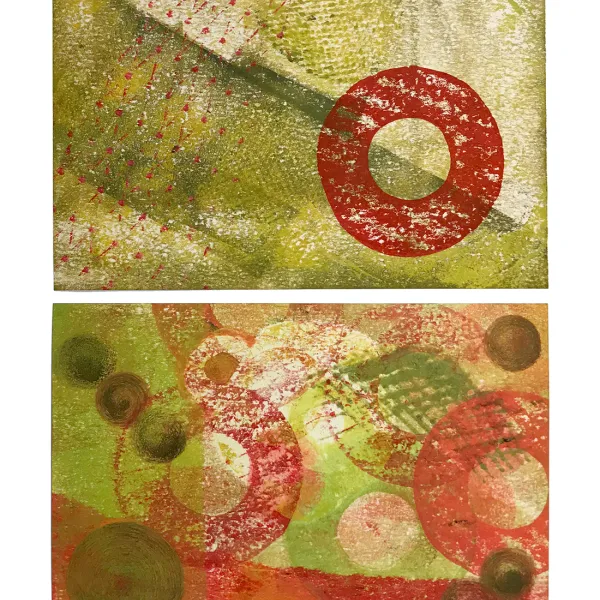 Two abstract (fabric?) panels with olive green backgrounds and olive green and red shapes printed on them.