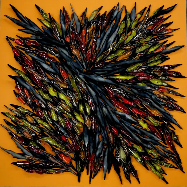 Abstract sculpture: a multi-colored clump of oblong objects, pointed at the ends, all pointing in different directions.