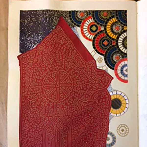 Red house with a starry night sky. There are two rows of decorated overlapping circles above one side of the roof. Below are scattered lighter decorated circles.