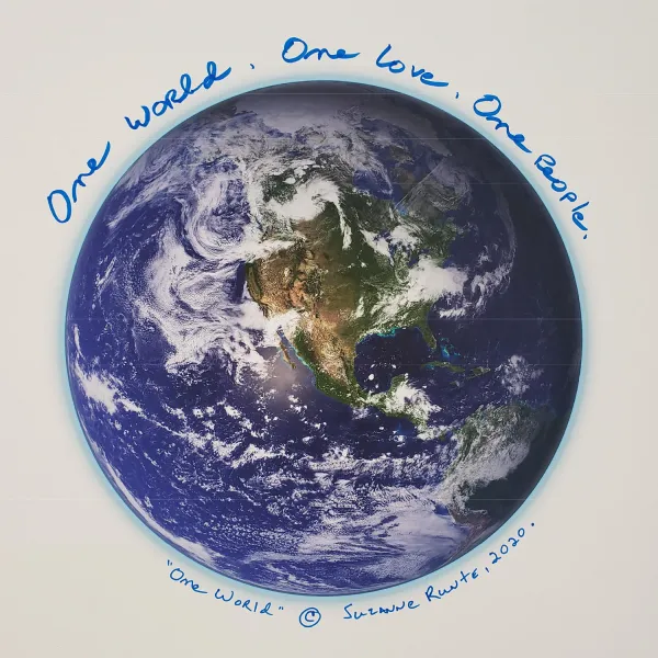Above a picture of the earth, it says "One world. One love. One people." 