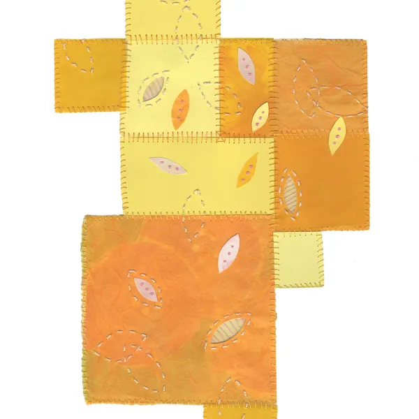 Orange and yellow squares with leaves on them. The squares look like they're stitched together the way a quilt is.