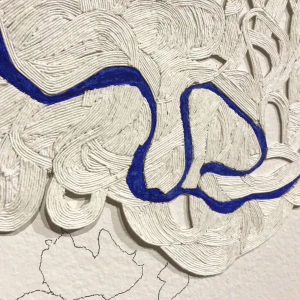 Rina Yoon, Trace of Time, 2019 (detail), hand-coiled paper, pigment, graphite, approximately 8 feet tall x 16 feet long Close-up of coiled paper with a blue line wandering through it (like a river on a map).