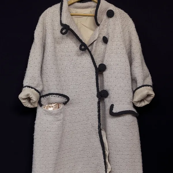 Anna’s handmade tan coat, black trim archival pigment print, 48 x 32", 2019