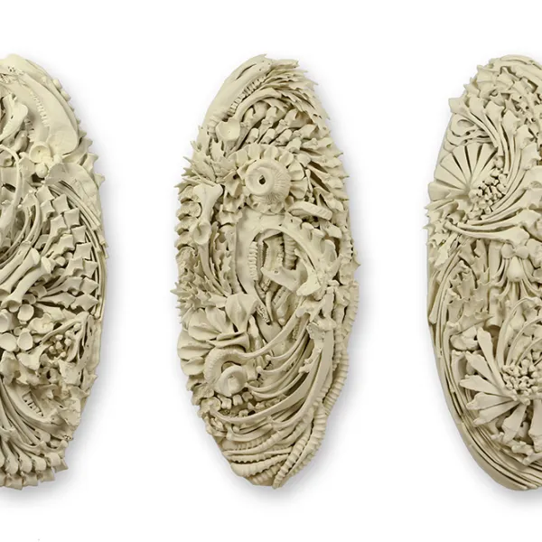 Judy Onofrio, Swirl 1, 2, 3, 2017, bones, cast bones, acrylic paint, photo credit: Rik Sferra Three vertical oval sculptures with intricate patterns.