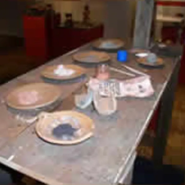 Work table with ceramics on it