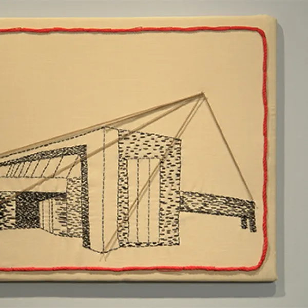 Artwork made of fabric and string, depicting the architecture of a building.