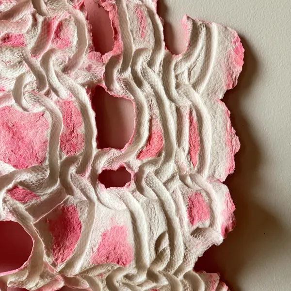 Handmade paper with pressed coils and florescent pink color