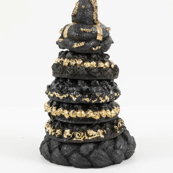 Headweights; Cast iron and gold leaf