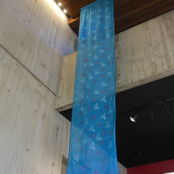 Rising, 2026; Woodblock printing, painting, and writing on Bangladeshi cotton saris; 48 x 216 inches, each
