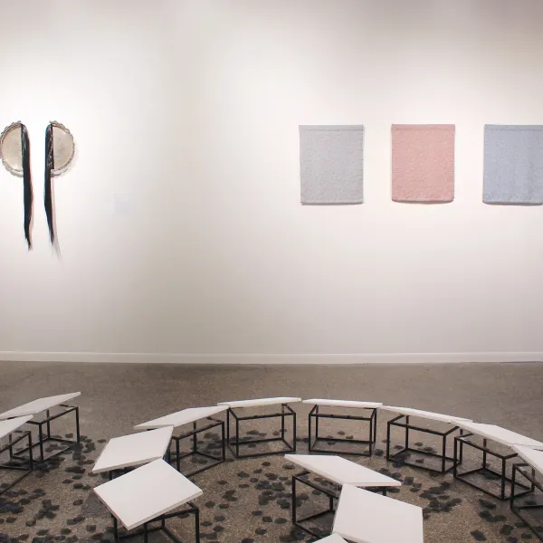 Nirmal Raja- Untitled, 2023; Found silver-plated platter and synthetic hair 36 x 23 ½ x 2 inches | Indrani Nayar-Gall | Fawzia Khan- Variations on a Theme: Black, Red and Blue, 2026; Handwoven cotton