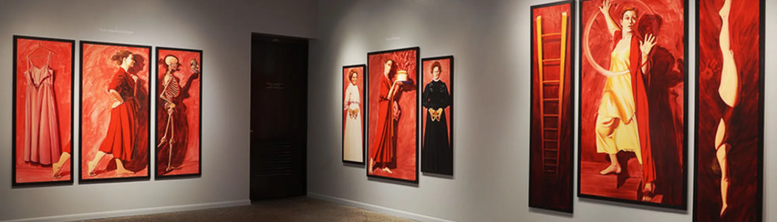 Inside gallery showing 9 paintings