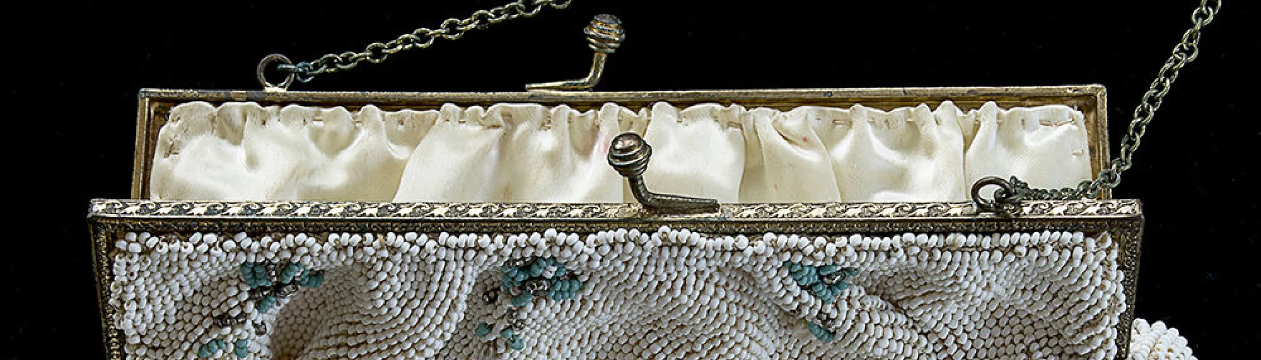 Vintage white beaded purse with turquoise beaded flowers and metal clasp