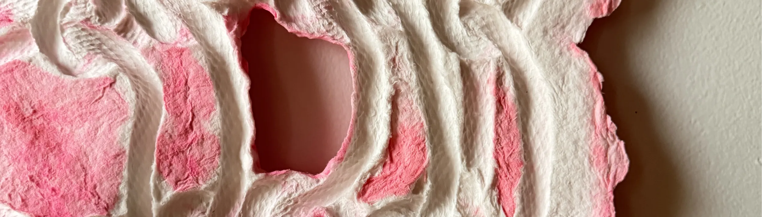 Handmade paper with pressed coils and florescent pink color