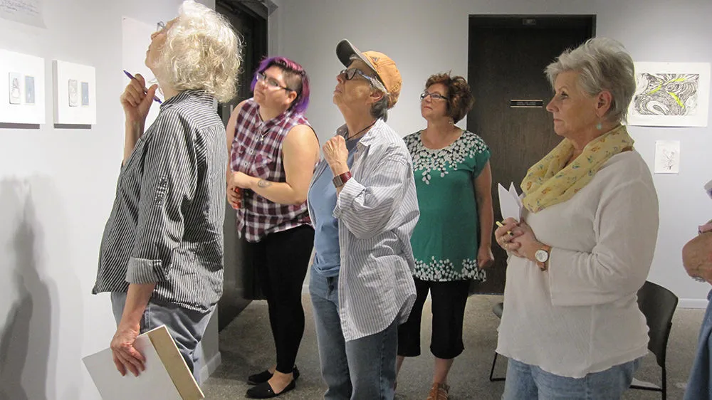 Group of women viewing art at the gallery