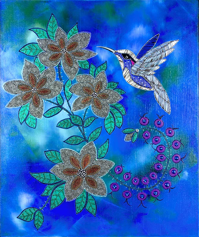 A beaded Quilt of a humming bird and flowers