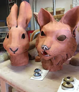 Photo of terra cotta anthromorphic animal heads in progress