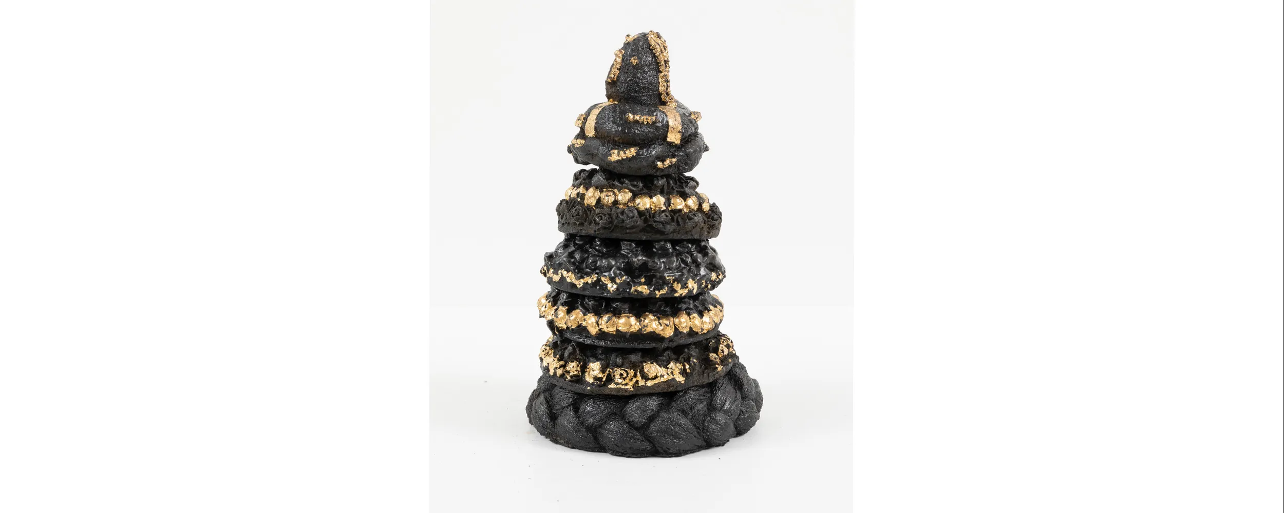 Nirmal Raja, Headweights, 2023, Cast iron and gold leaf